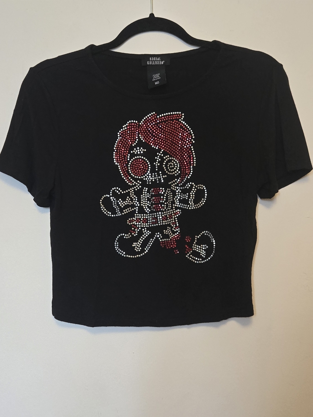 ✨ Social Collision black crop tee with a rhinestone skull gingerbread man